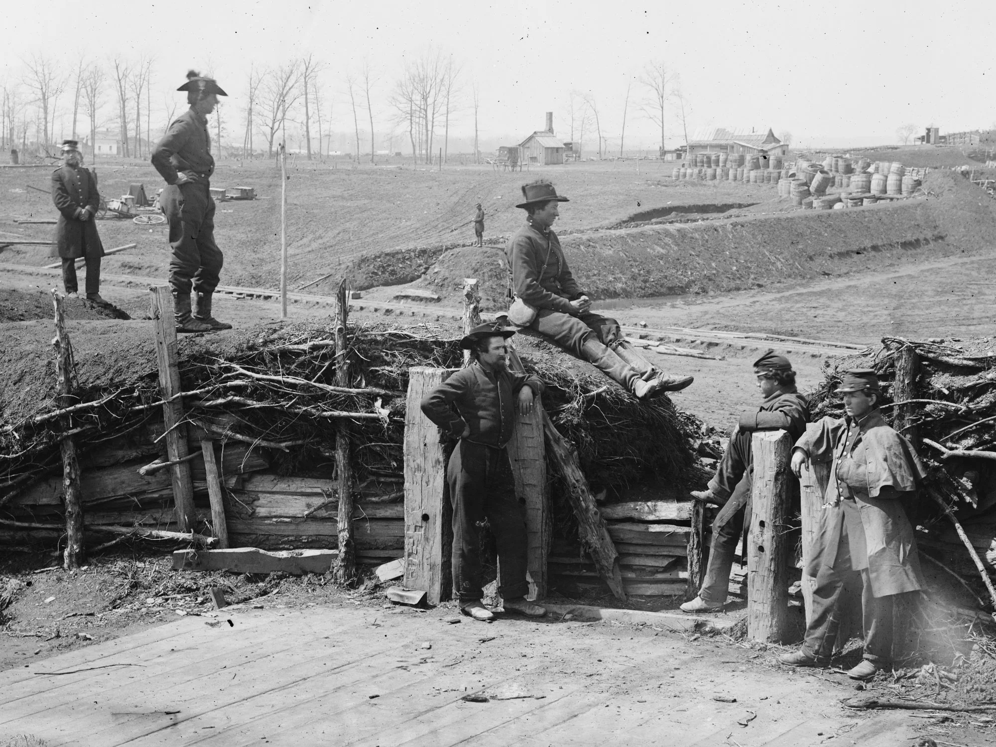 March, 1862. Confederate fortifications now held by Federal soldiers. It appears as though all six men have dark blue pants. (LOC#: LC-B817-7171)