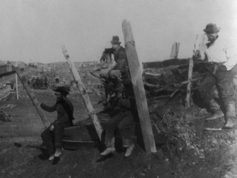 March, 1862. Here is a view of three men wearing dark blue pants and one man seated at the top is wearing light blue pants. (LOC#: LC-USZ62-83480)