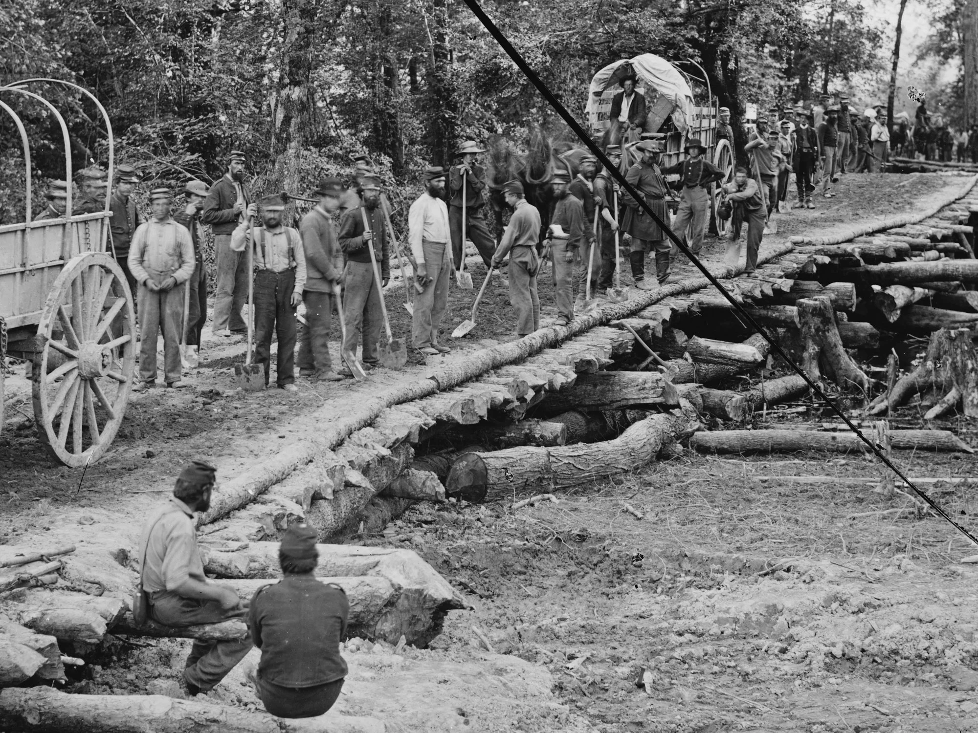 May 27-28, 1862. Nine memebers of the 5th NH can be seen here in dark blues as they built this bridge across the Chickahominy River, Va. (LOC#: LC-B817-7383)