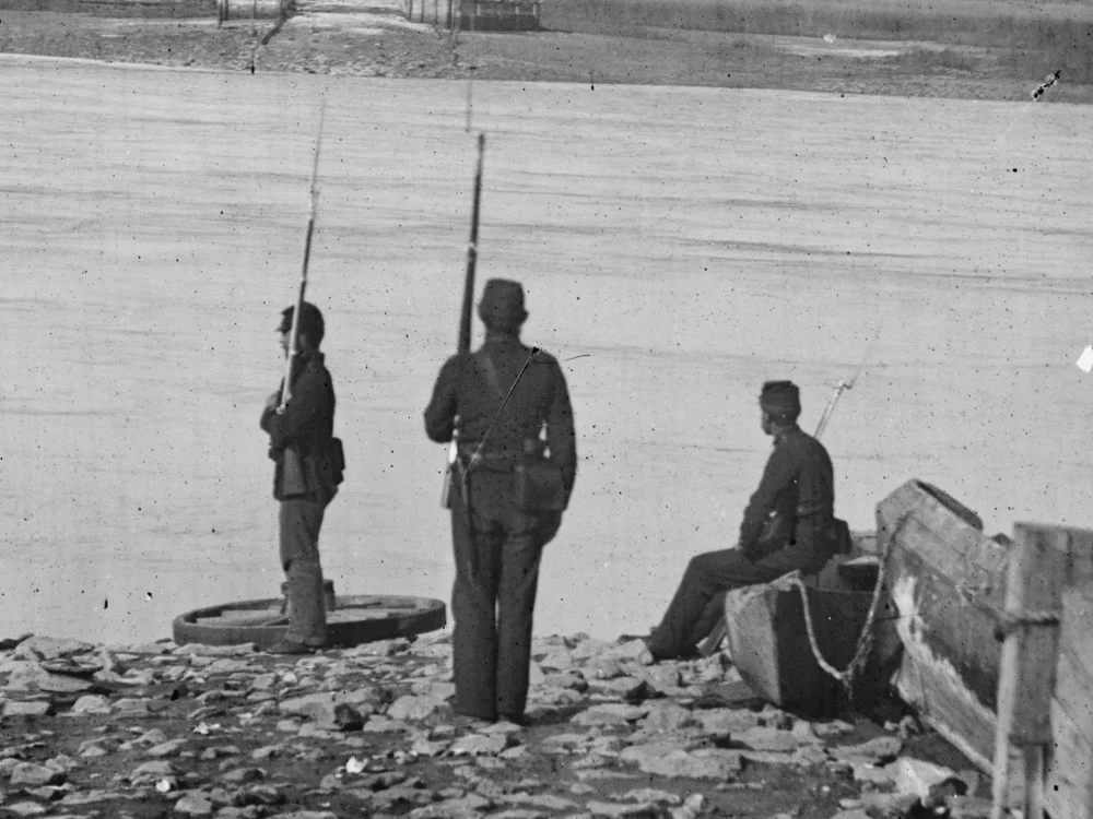 Summer/Fall, 1862. Coosaw Ferry, Port Royal Island, SC. Still transitioning to sky blues, two of these three men are wearing dark blues while on guard duty. (LOC#: LC-B811-201)