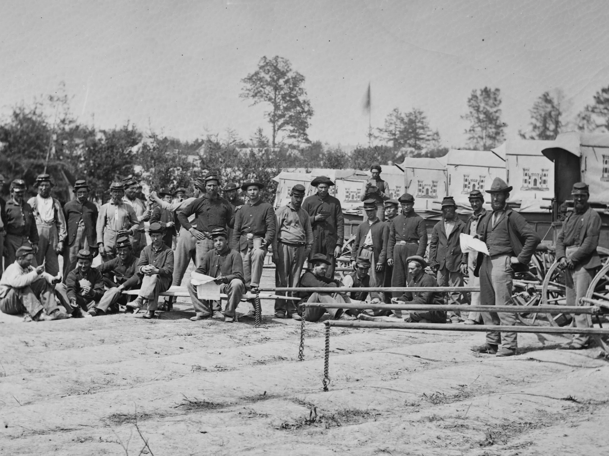April, 1863 Men and wagons of the Engineer Corps ambulance train near Falmouth, Va. Two pairs of dark blues are still worn among these men. (LOC#: LC-B815-516)