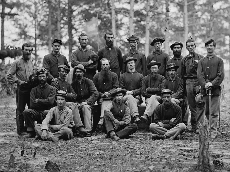 August, 1864 Petersburg, Va. The two Sergeants within this group of men from Co. B of the Engineer Battalion are wearing dark blues. (LOC#: LC-B817-7219)