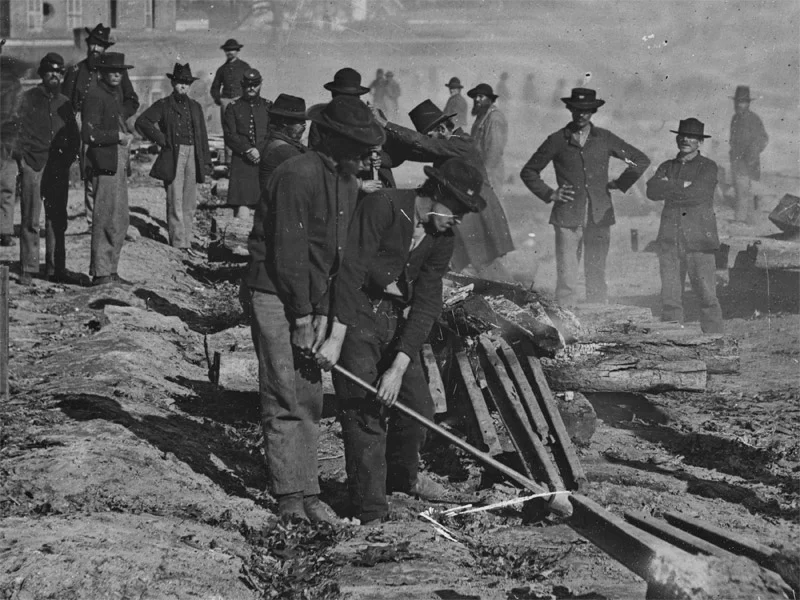 September, 1864 Atlanta, Ga. Shown are Sherman's men destroying railroad. A man in the foreground is seen wearing dark blue pants. (LOC#: LC-B811-3630)