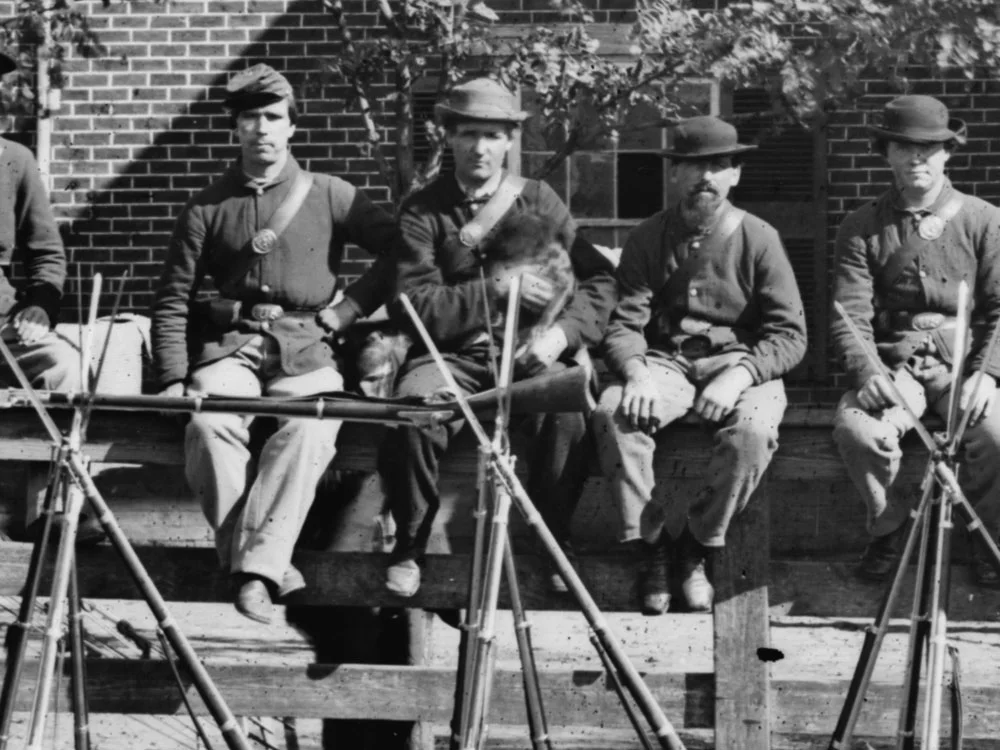 April, 1865 In the same scene at Appomattox Court House, a second man wearing dark blues is sitting on the fence. (LOC#: LC-B817-7193)