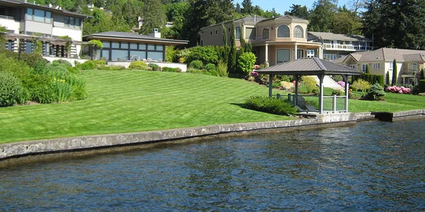 Turf grass has its place, but overuse neither filters runoff nor prevents shoreline erosion.