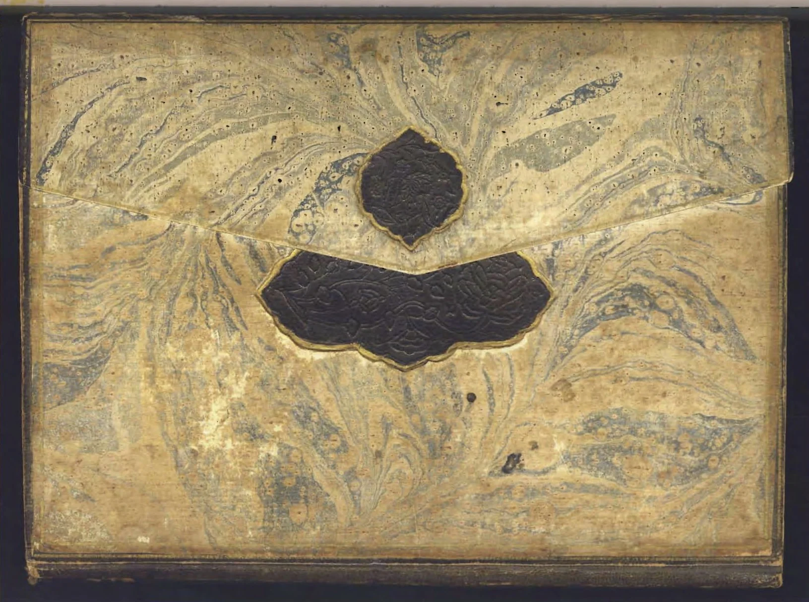 Binding made of blue-and-white marbled paper, Ibrahim Muteferrika's Tarihu'l-Hindi'l-Garbi el-Musemma bi Hadis-i Nev, 1142/1730, 22 x 16 cm, DR 403, M825. The Lilly Library, Indiana Univeristy, Bloomington.