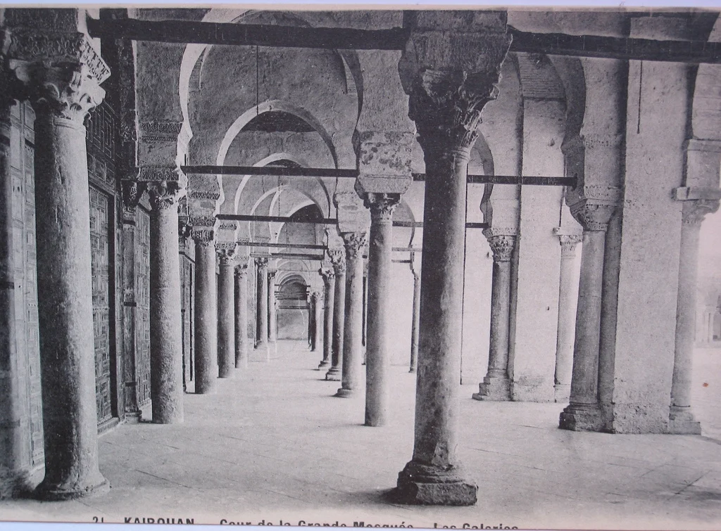 Ancient Roman columns in Islamic hypostyle hall. The Prayer hall of the Great Mosque of Kairouan, Tunisia. Vintage postcard.