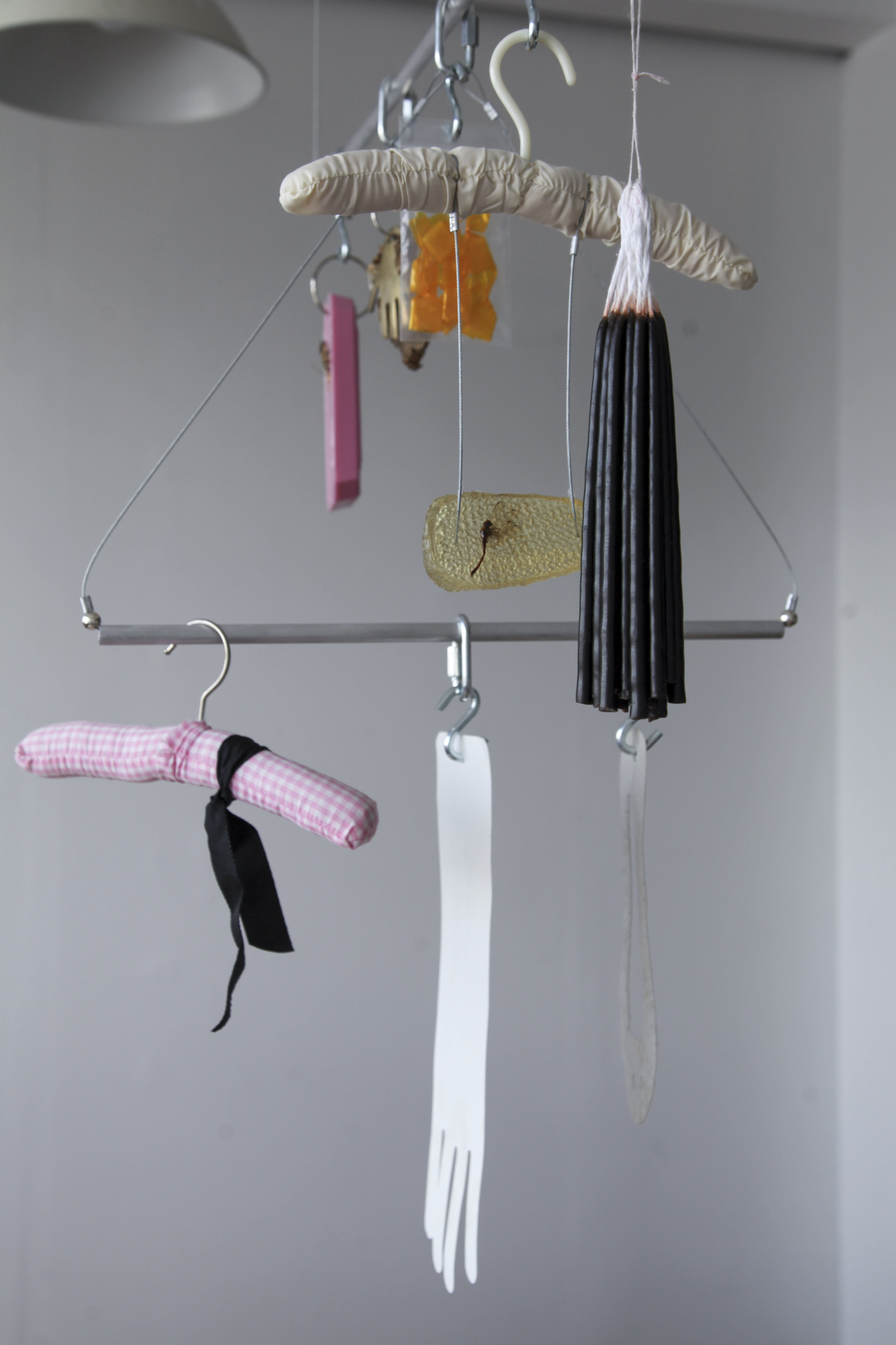   Mobile , Nadia Gohar, silicone mould, butterfly, sunflower, horse brass, gum arabic, dragonfly in cast resin, candles, clothing hangers, ribbon, found paper, steel rod, and wire rope, 2017 