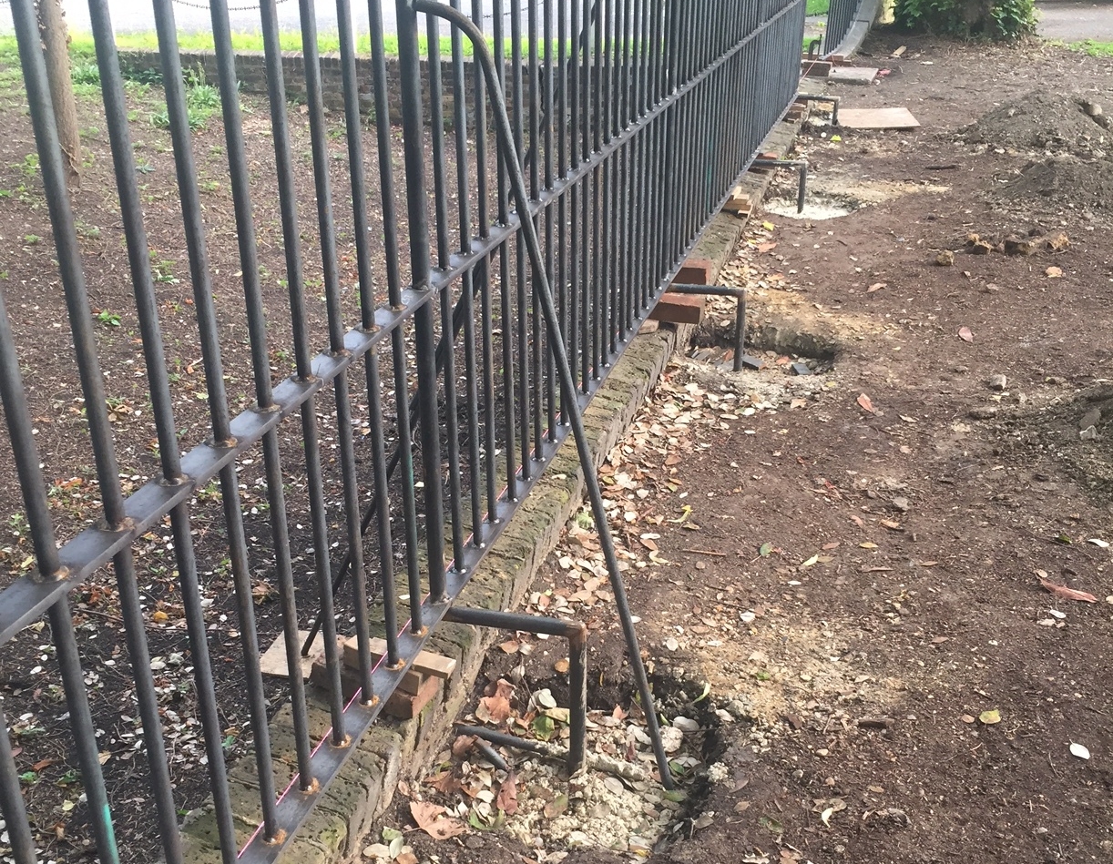 The railings discreetly supported from behind so as not to damage the original wall.