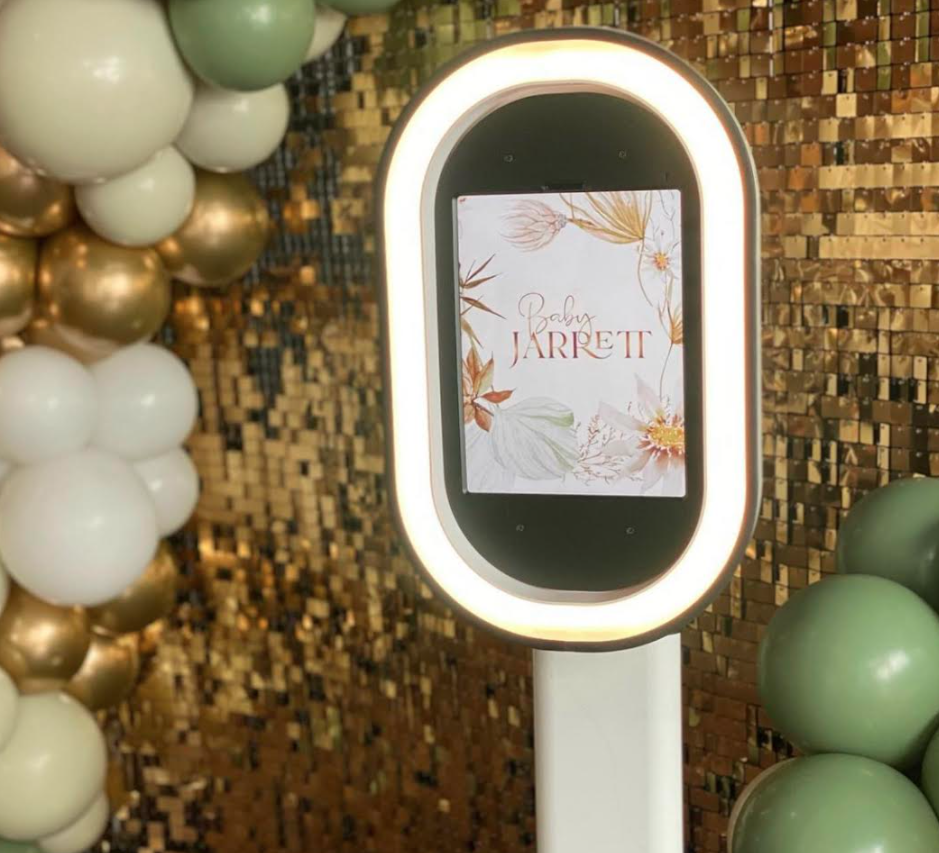 Salsa iPad ring light photo booth setup with custom welcome screen, gold sequin backdrop, and balloon arch for an event in Portland.