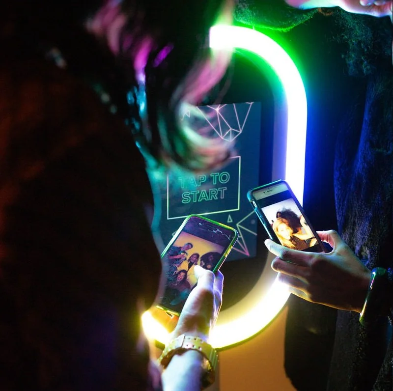 Guest instantly sharing a branded event photo from a corporate photo booth in Portland