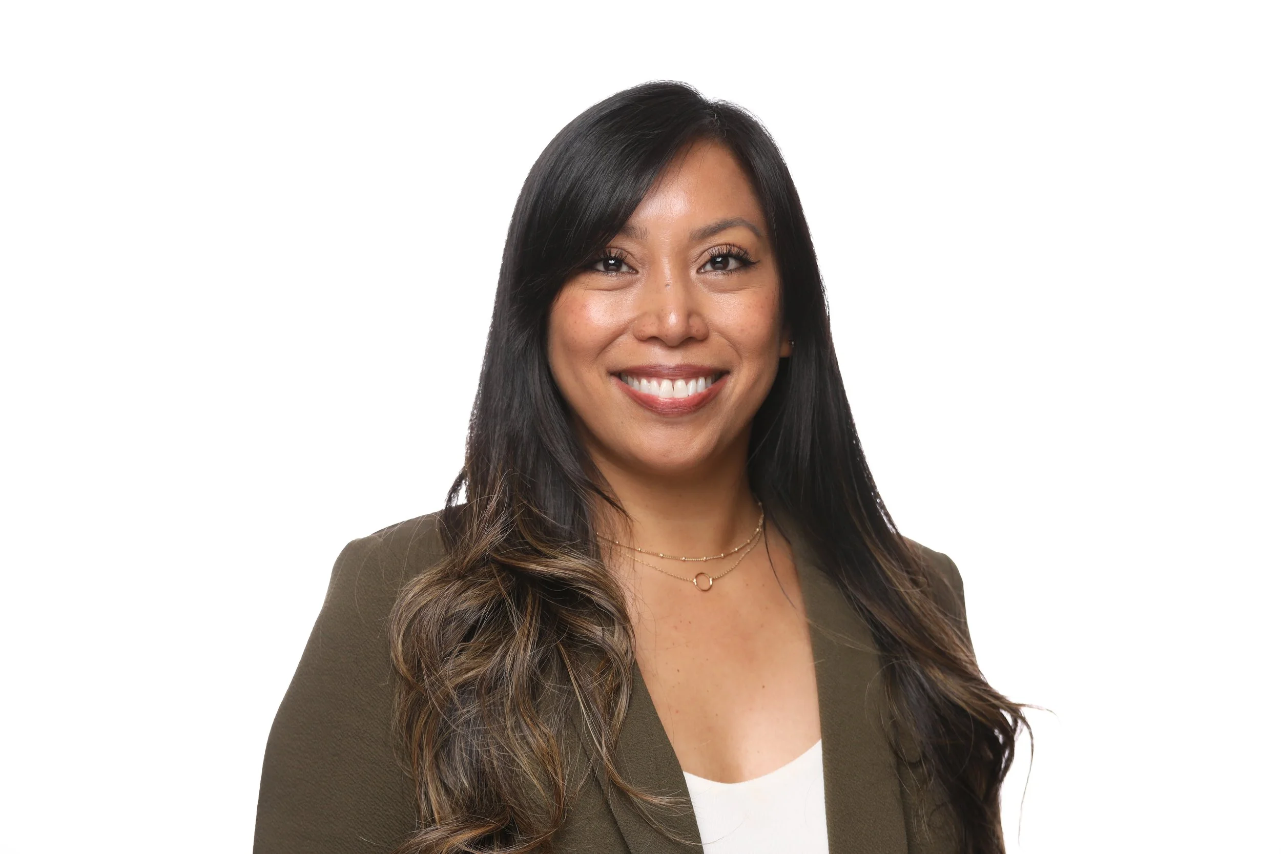 Woman smiles for corporate headshot photo