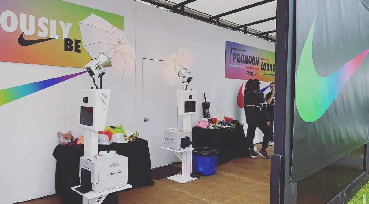 Custom branded Nike photo booth setup inside The Pronoun Lounge at the Portland Waterfront Pride Festival.