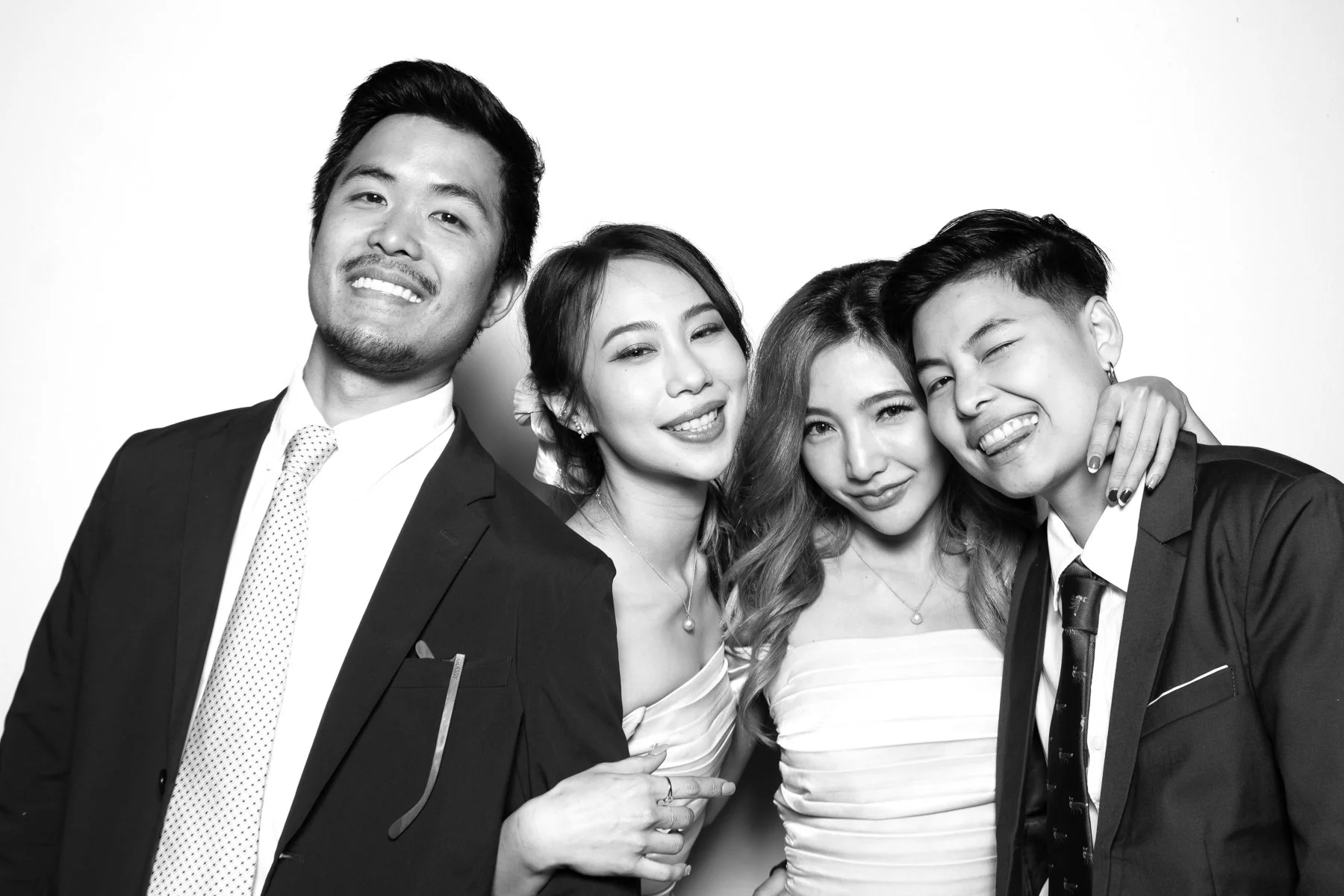 Wedding group poses in glam photo booth