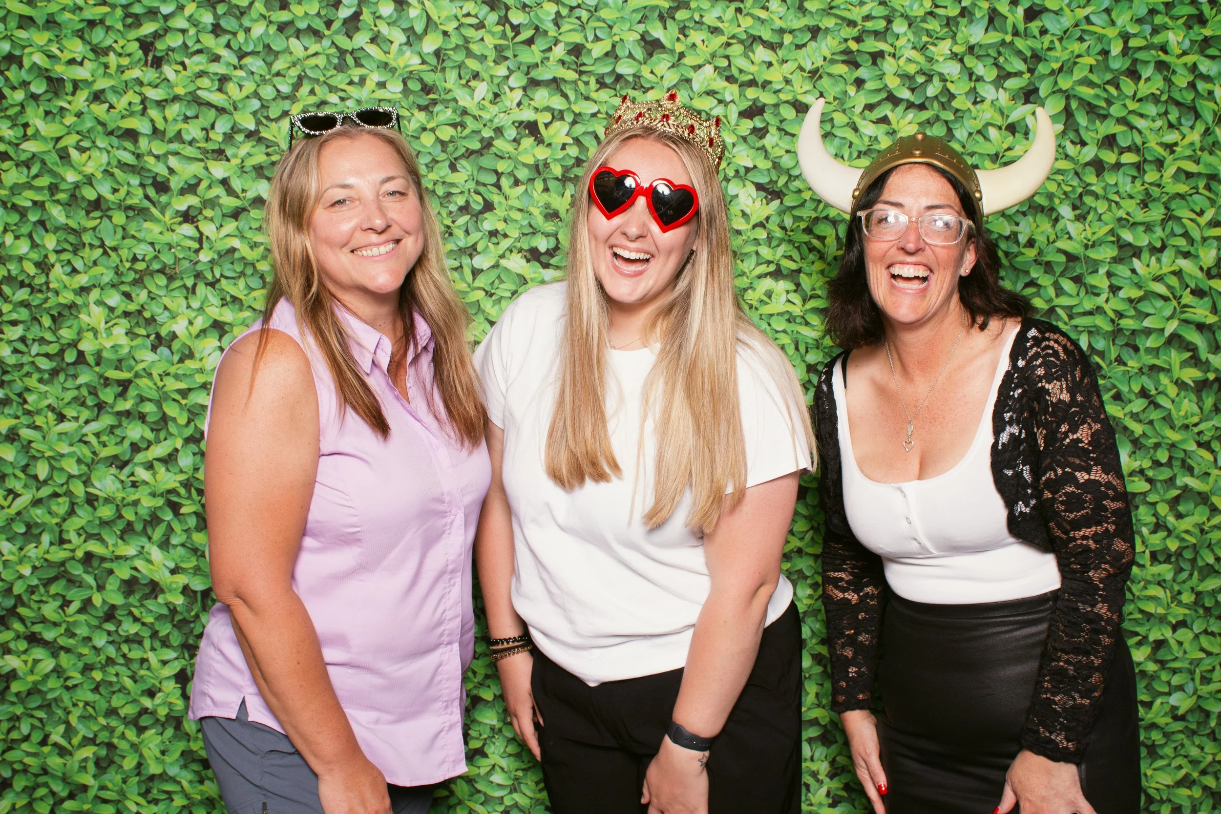 Guests smiling in a mobile photo booth at the Heathman lodge in Vancouver Washington