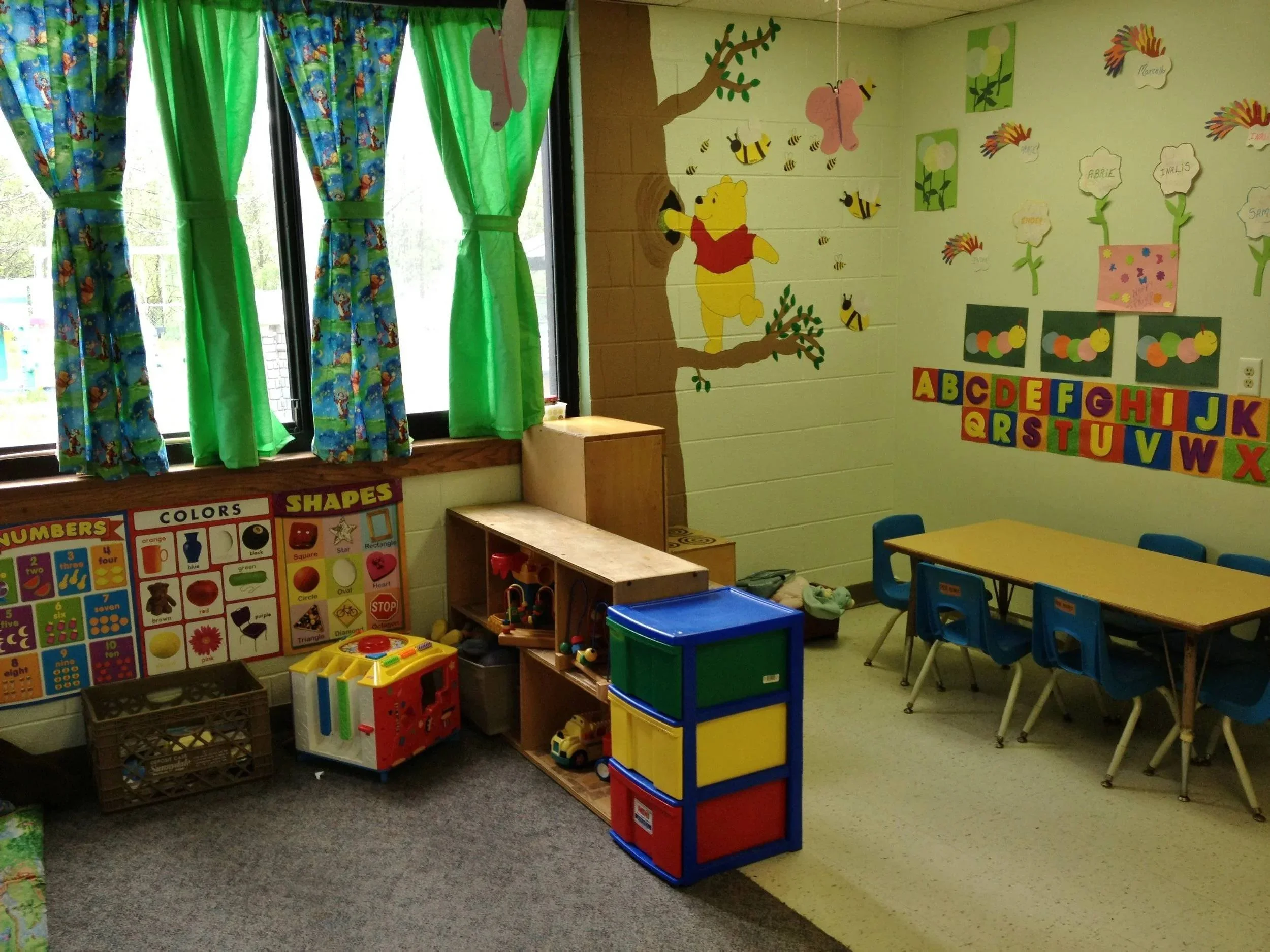 Toddlers participating in a hands-on classroom activity