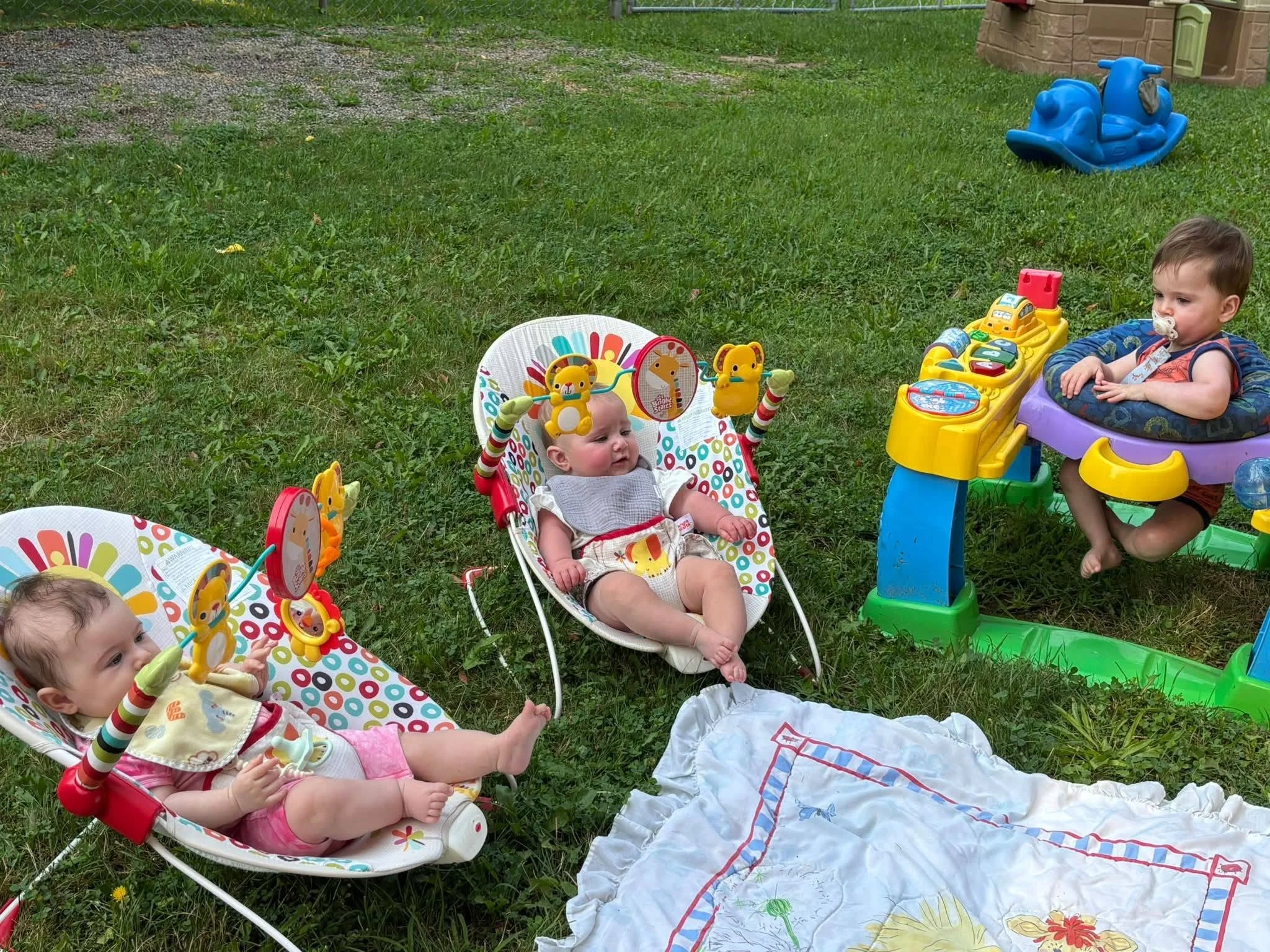 Infant exploring a developmental activity at Twelve Corners Day Care Center