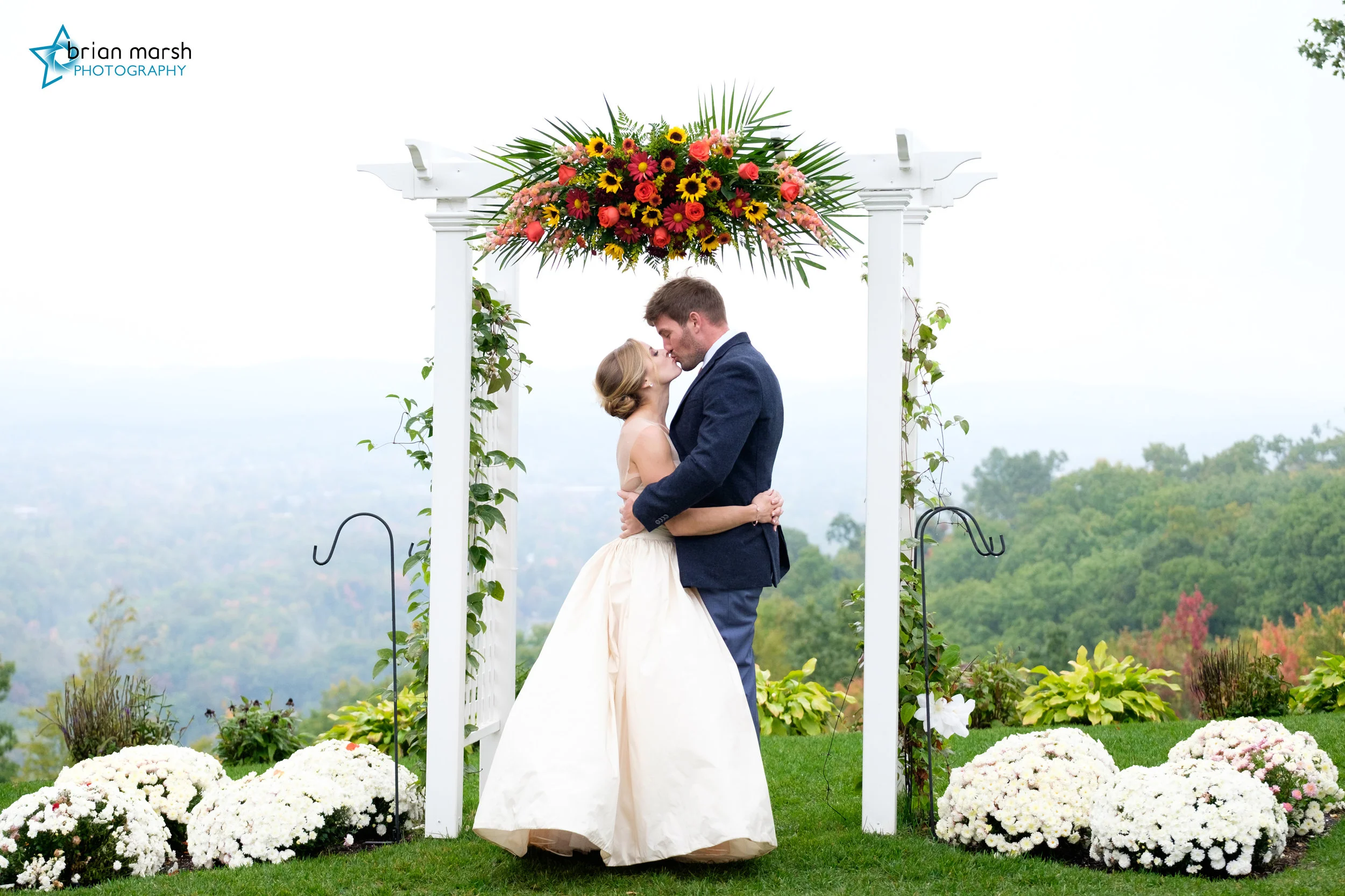 Ryan And Meredith Kissing Arch.jpg