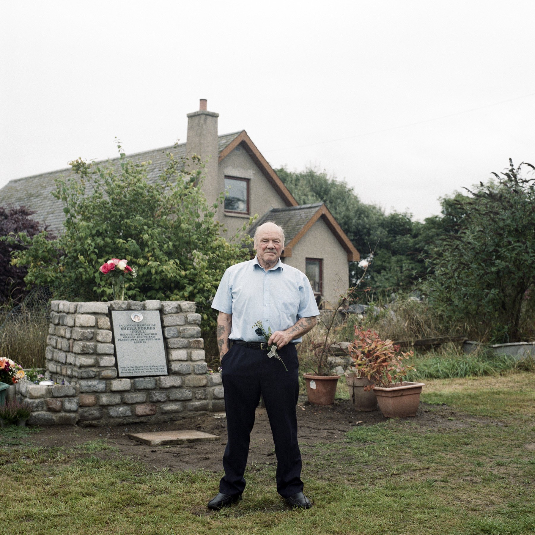 Mike with Sheila's cairn after burying her ashes at Mill of Menie, 2021