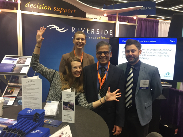 Riverside employees having fun at the booth