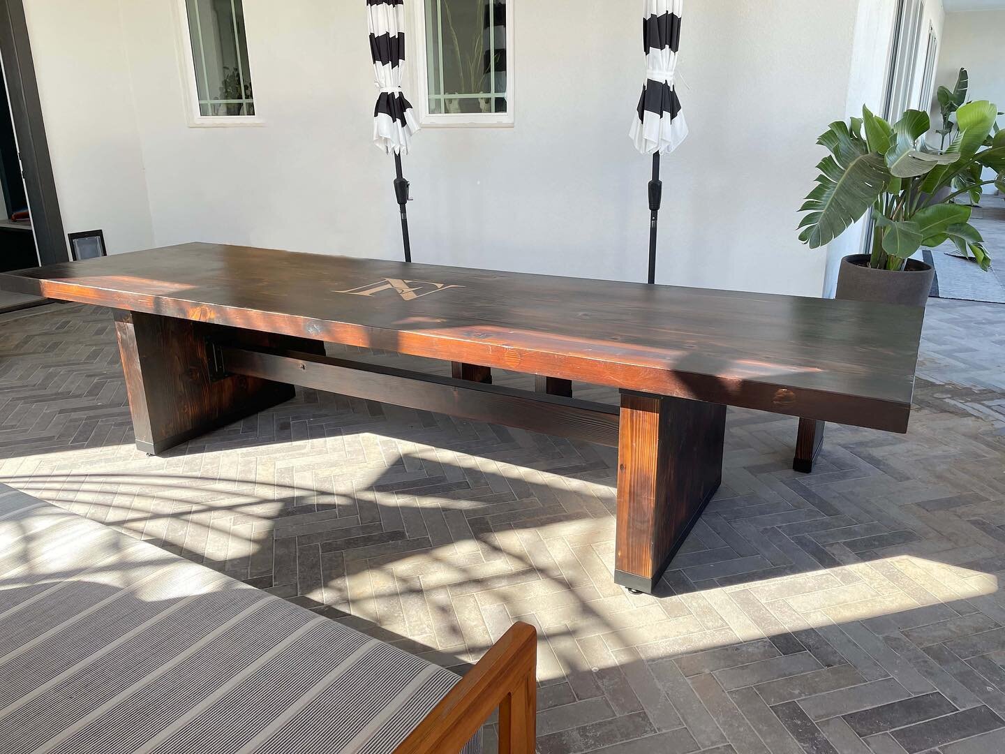 Our latest furniture project was this 12 ft. long cedar table. The design direction was for it to be in a medieval style. Rather than staining the wood we used the shou sugi ban burning method for treating and coloring the wood. The custom designed m