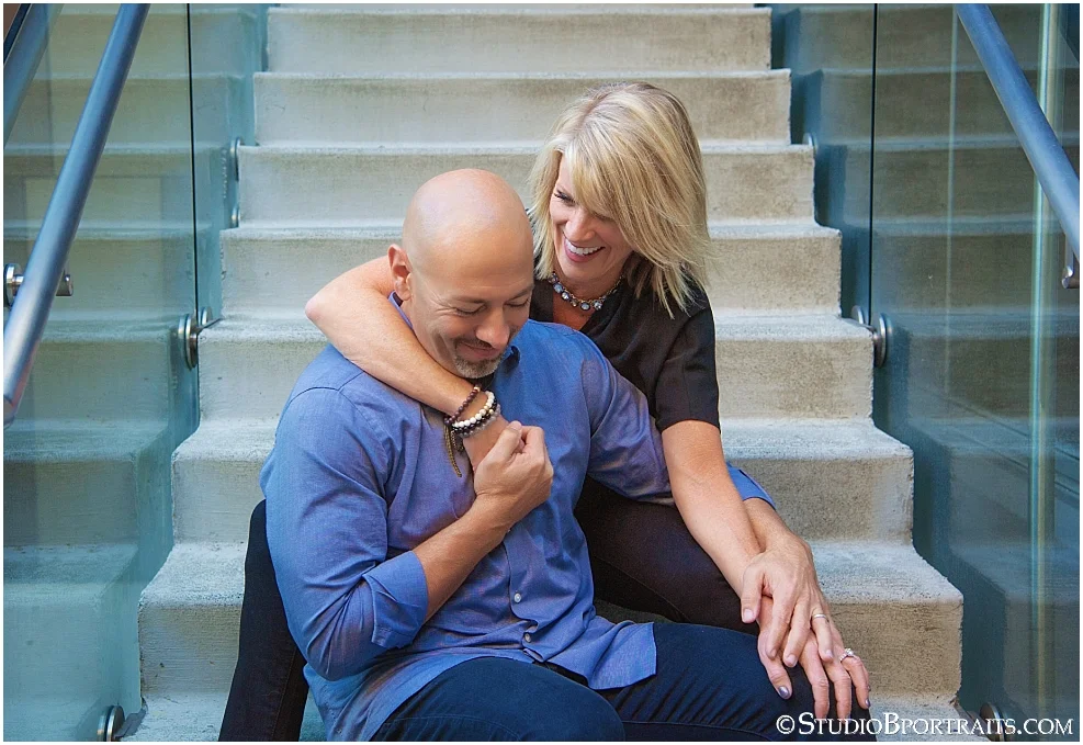 Studio B Portraits Seattle of cute couple laughing on stairs near Amazon_0088.jpg