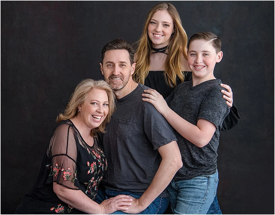 You’re never fully dressed without a smile! The Hancock Family photographed in dark and denim at StudioBportraits.com