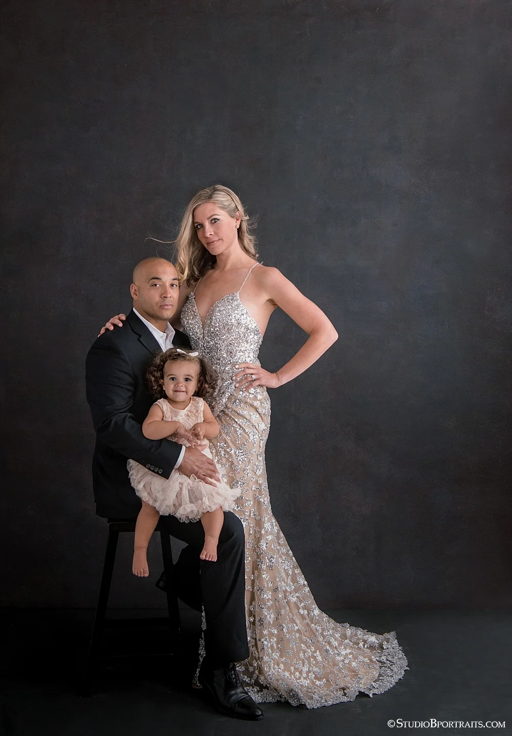 Fierce with a little bit of baby fabulous has never looked so beautiful. Mom’s gown courtesy of Samila Boutique in Redmond. Make-up, Tiffany Penton and Hair: Wesley Kelly