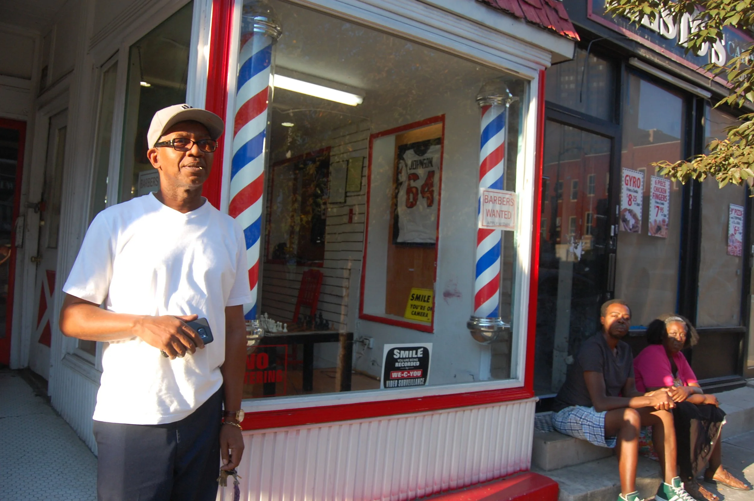 Black man in front of Shop.JPG