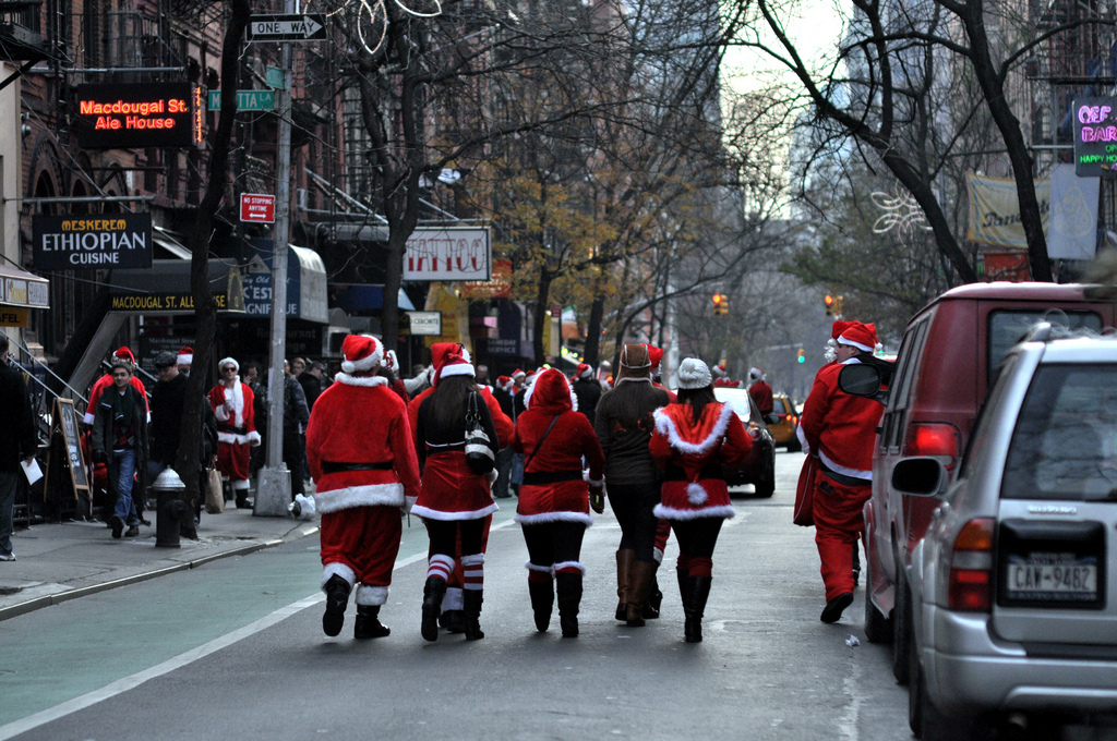 Santacon participants walk down MacDougal Street on Saturday, December 13, 2010 in New York, NY