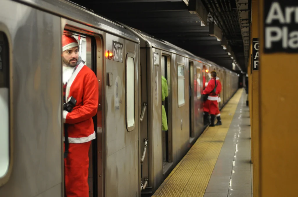 Santacon participants on a Manhattan bound 3 train in Brooklyn, NY on Saturday, December 12, 2009.