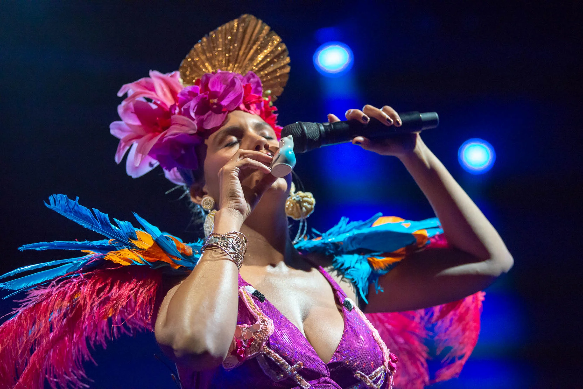 Li Saumet of Bomba Esteréo blows a whistle shaped like a bird on Saturday, August 10, 2019.