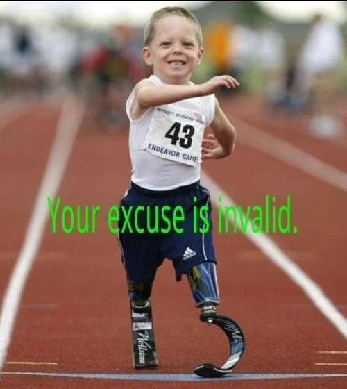 This image is of a little boy running in what appears to be a race by the race bib on his shirt. The boy is smiling. He has 2 prosthetic legs. The text across the pic says “Your excuse is invalid”