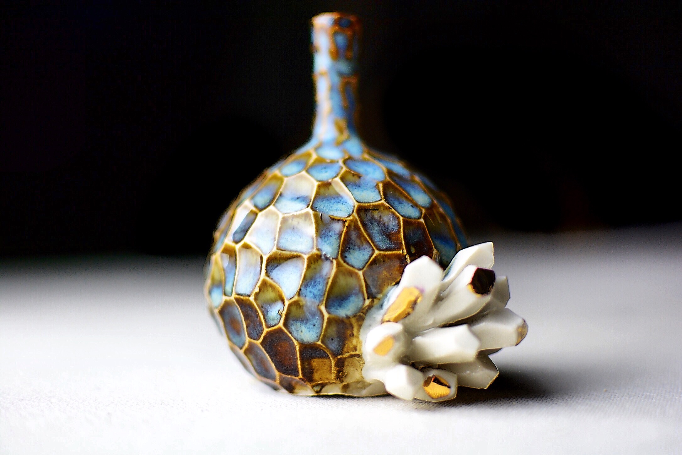 Mini rutile blue vase with a white crystal cluster. 