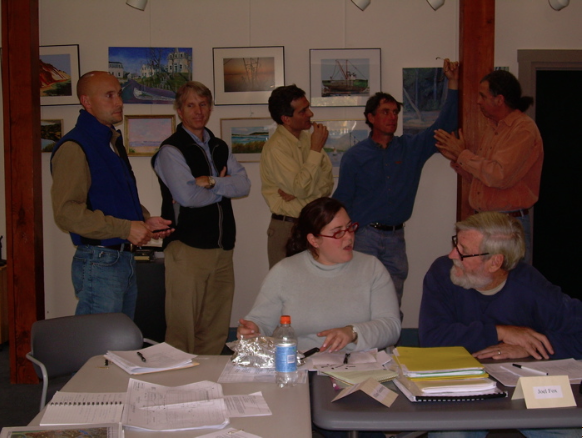 In the foreground: Hillary Greenberg, Wellfleet Health and Conservation Agent; Joel Fox, Aquaculturist. In the background are three representatives from the consulting firm of ENSR, who are working with the HRTC. From left to right, Mike Ball, ecologist; Dennis Lowrey, wetlands ecologist; Firooz Pannah, bridge engineer. Eric Derleth and Stephen Spear are HRTC members.