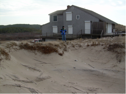  DUNE BLOW OUT ON BAY SIDE BARRIER BEACH IN SOUTH TRURO. COASTAL DUNES PROVIDE PROTECTION FOR THE LAND BEHIND THEM. FOOT TRAFFIC DAMAGES STABILIZING BEACH GRASS. WITHOUT GRASS TO HOLD THE SAND, WINTER WINDS BEGAN SCOURING A GULLY THROUGH THIS DUNE. D