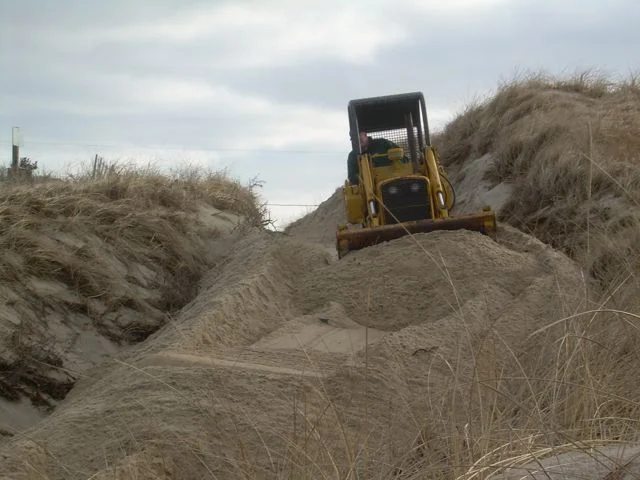 Sand being Bulldozed by Town
