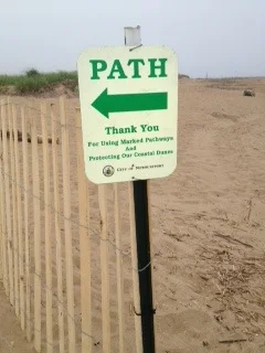 eroded pathways were reconfigured with fencing and pedestrian signage