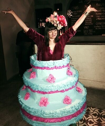 Sandra's 60th birthday fiesta -- Sandra as her own birthday cake. Piñata skirt by Eva and Jorge Rios. Photo ©2014 Tracy Boyer.