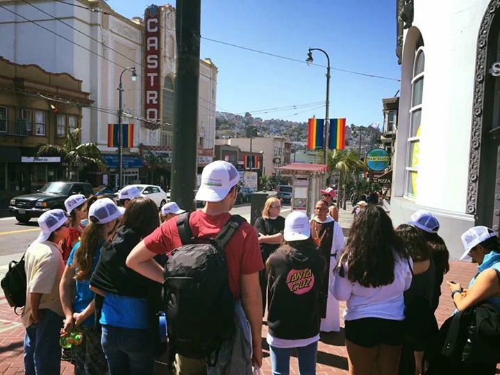 Br. Karekin gives a tour of the Castro to local church youth groups, explaining the reality of LGBTQ history as part of CDW's work in the neighborhood. 2016.