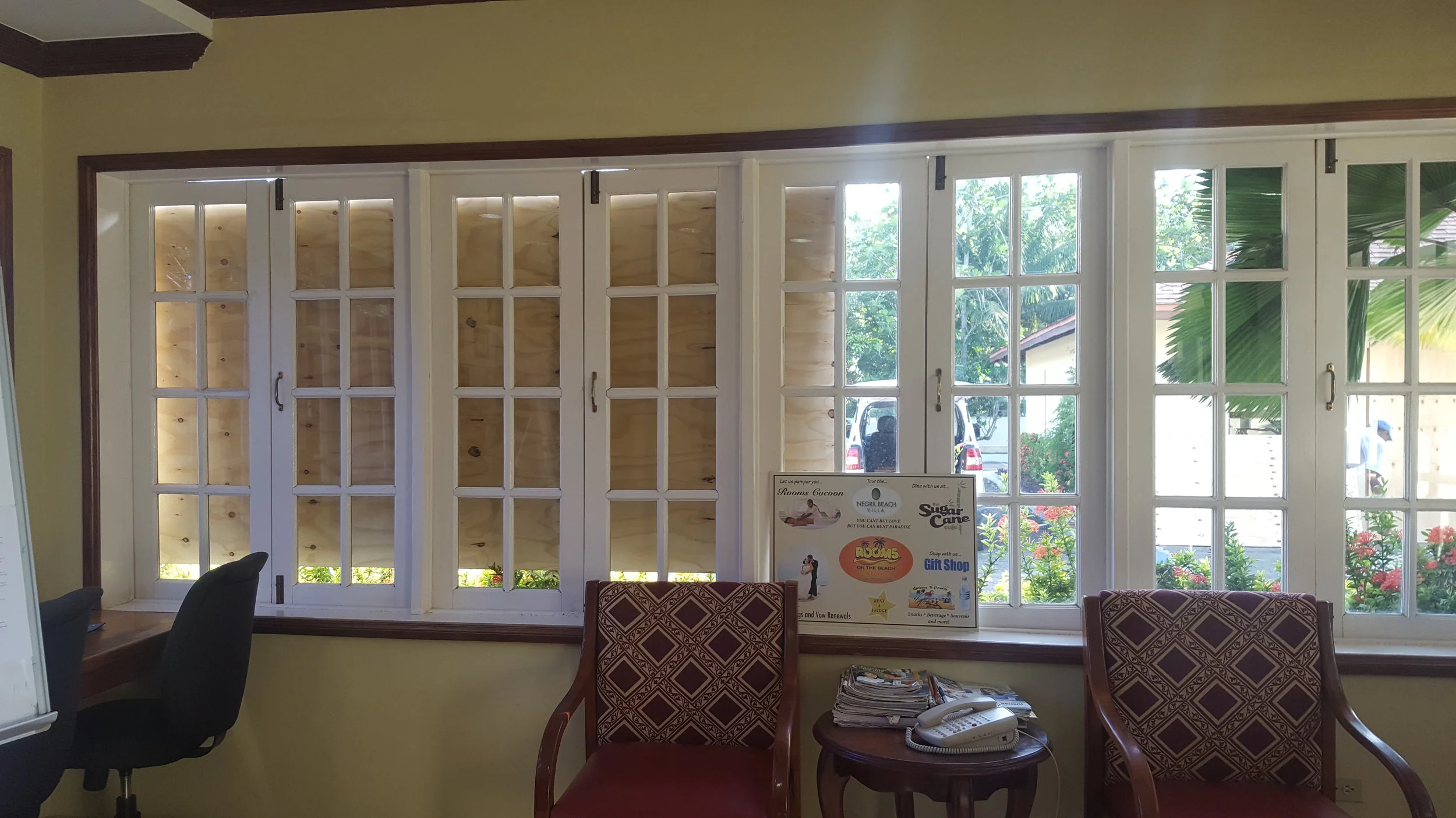 The maintenance staff was boarding up the windows at the hotel!