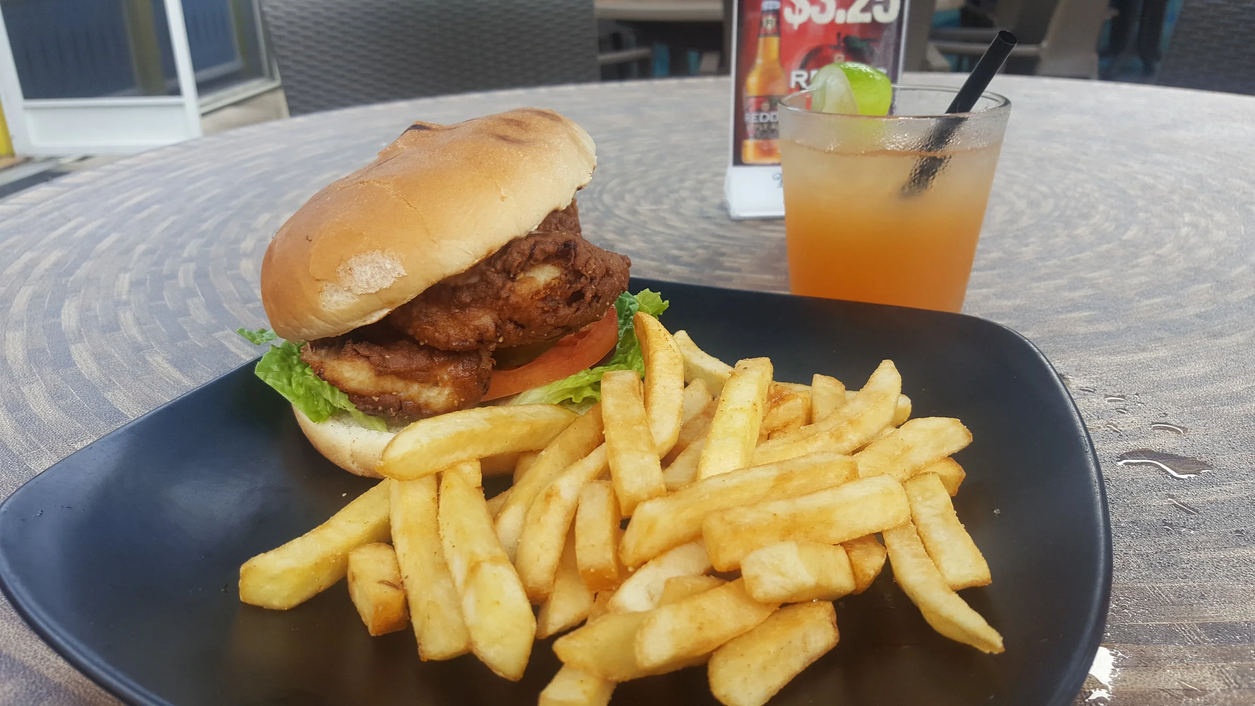 This lunch was $30 Canadian. At least it was delicious. A jerk grouper sandwich with a rum punch.