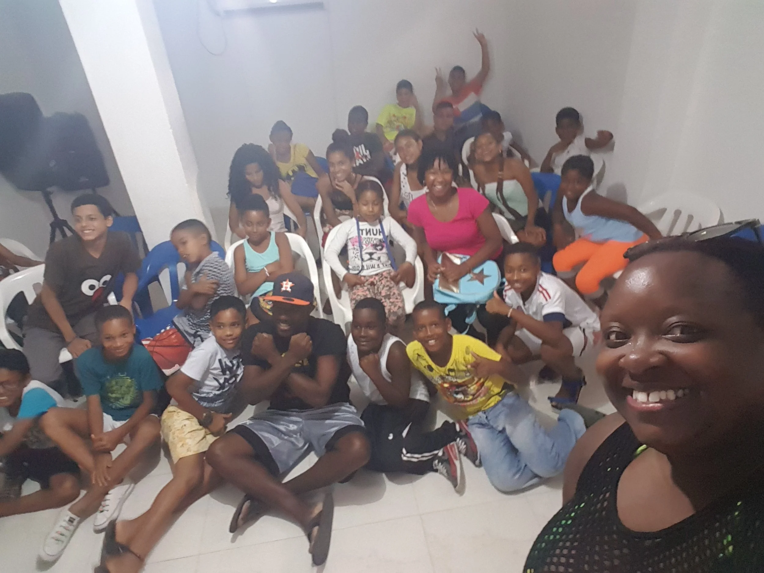 Sorry for the blur....But these are the kiddies with Alex at his Community Centre....as you can see I'm wearing my swimsuit and mesh cover up!! Smh.....