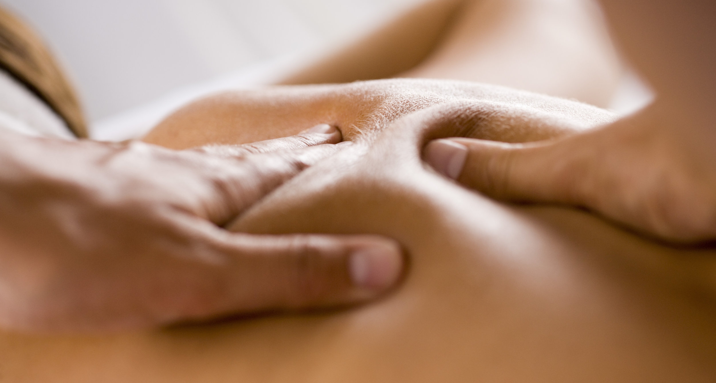 A person receiving a back massage