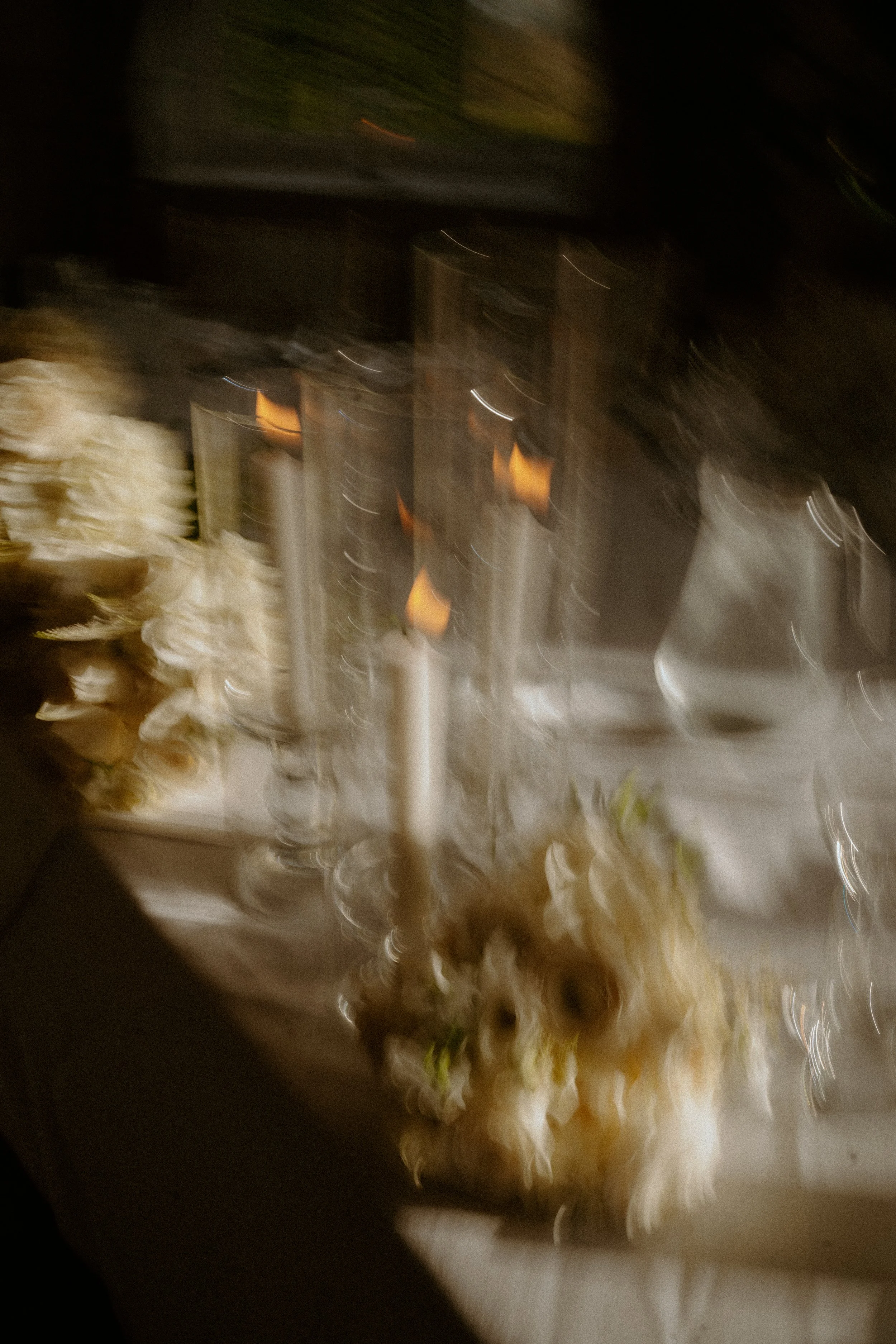 Blurred photo of a kitchen or food preparation area with scattered ingredients or food items.