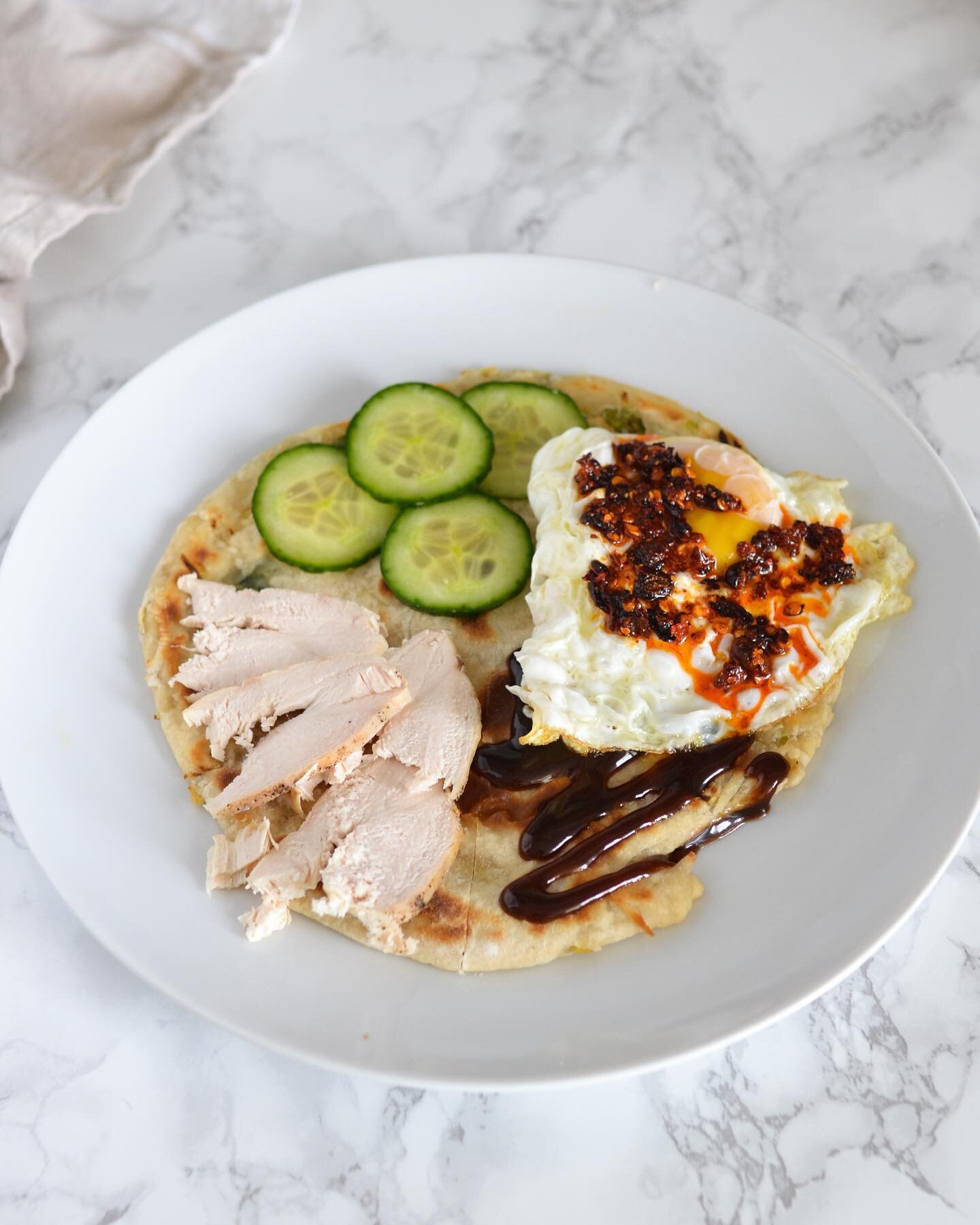 Tiktok made me do it 🙈 Tortilla hack inspired by @eatchofood 😍
Instead of a tortilla, I used a homemade spring onion pancake. I added leftover chicken, cucumber slices, a fried egg with chili crisp and hoisin sauce on the final quarter. 
Slice the 