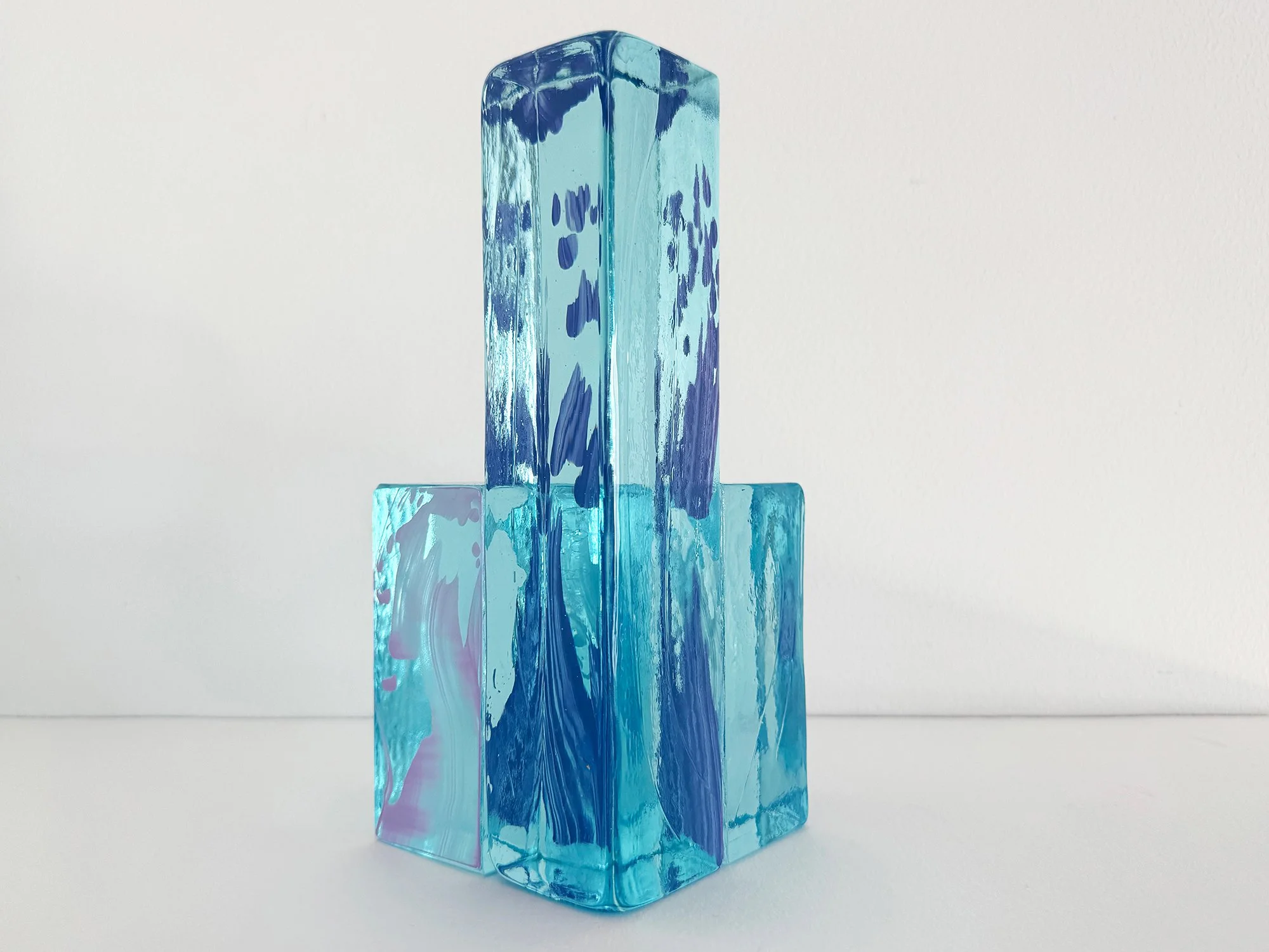 Contemporary cast glass artwork inspired by architectural brick structures