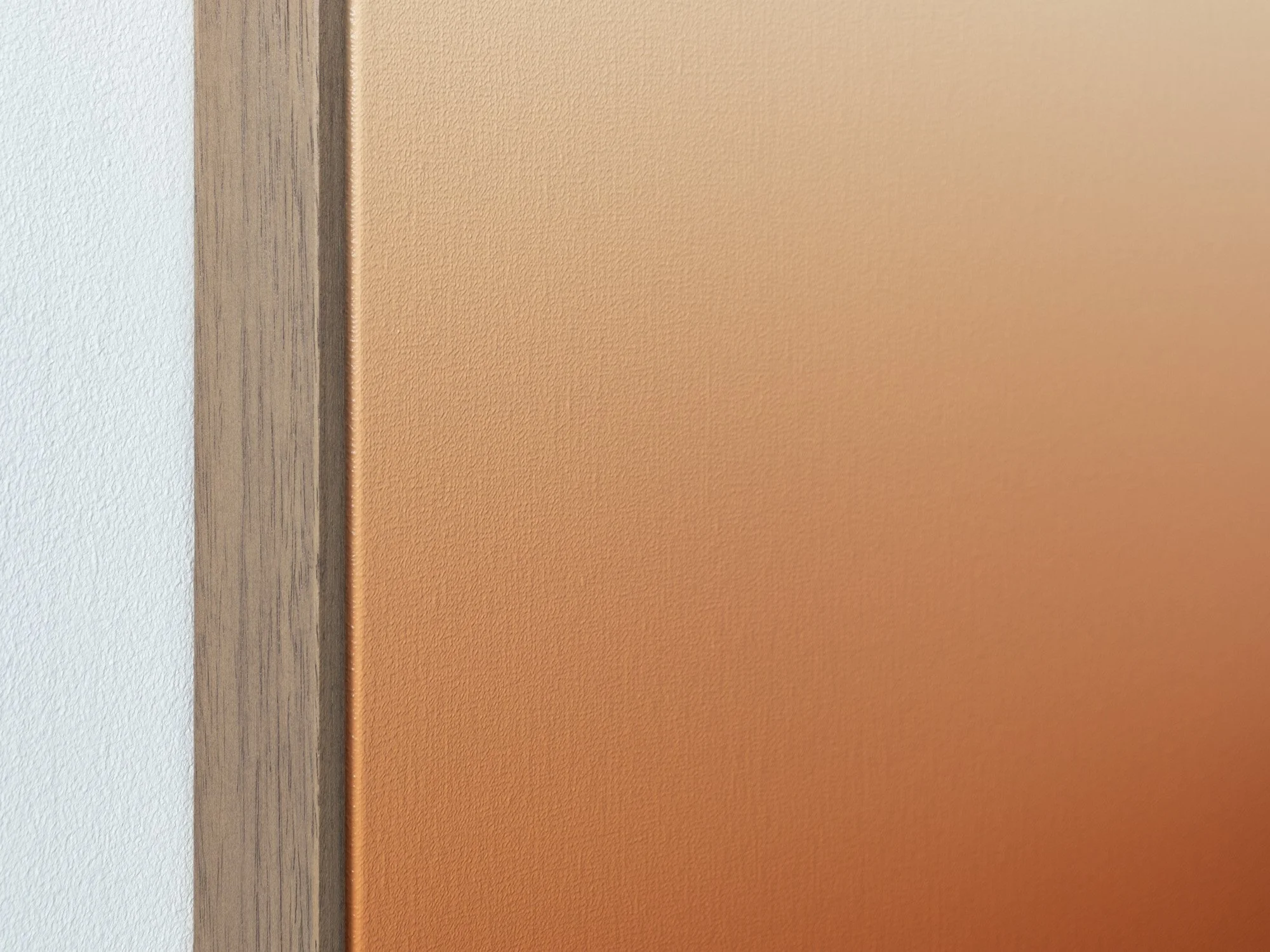 Close-up of the orange section of First Light (Orange and Cobalt) by Donald Schenkel, showing the oil-painted linen surface beside the wooden frame.
