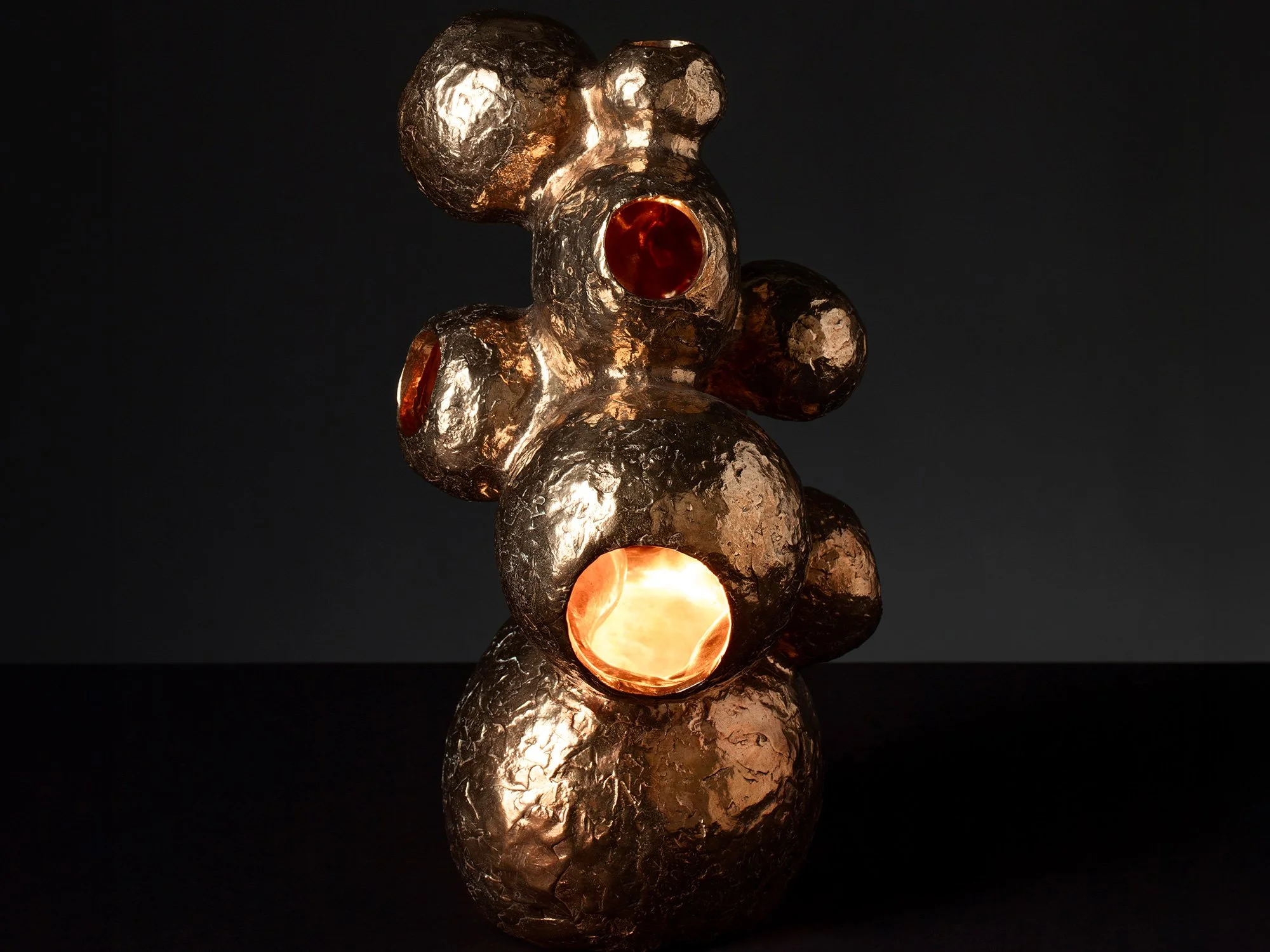 Jeske Haak artwork “The Rabbithole”, bronze and light sculpture exploring hidden landscapes.