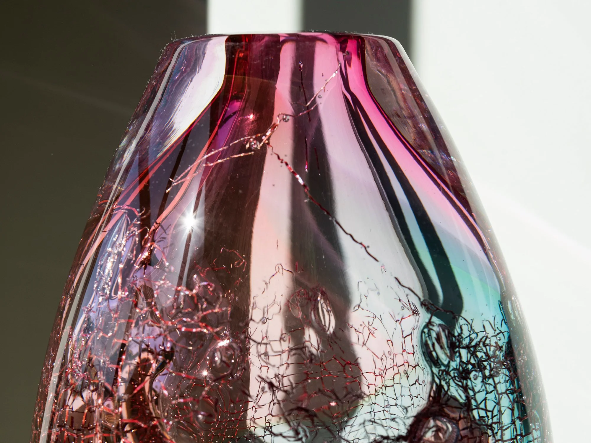 Detail of transparent pink and green blown glass in a contemporary sculpture by Francisca Snel